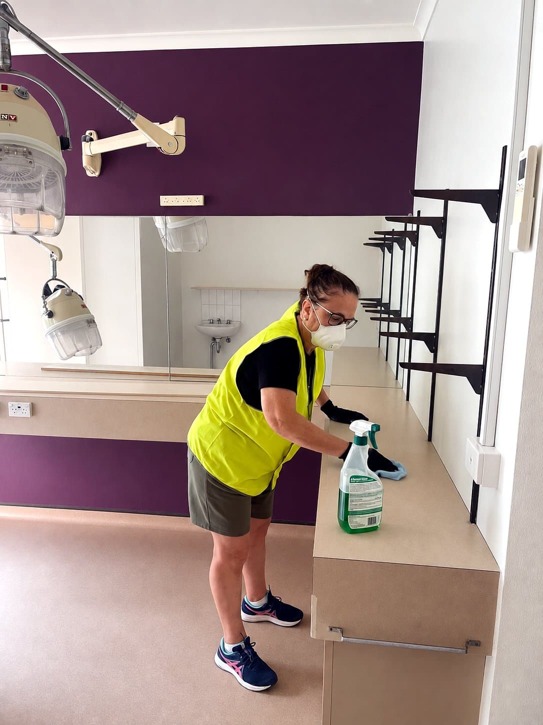 Focus cleaner in hi-vis detailing a new bathroom